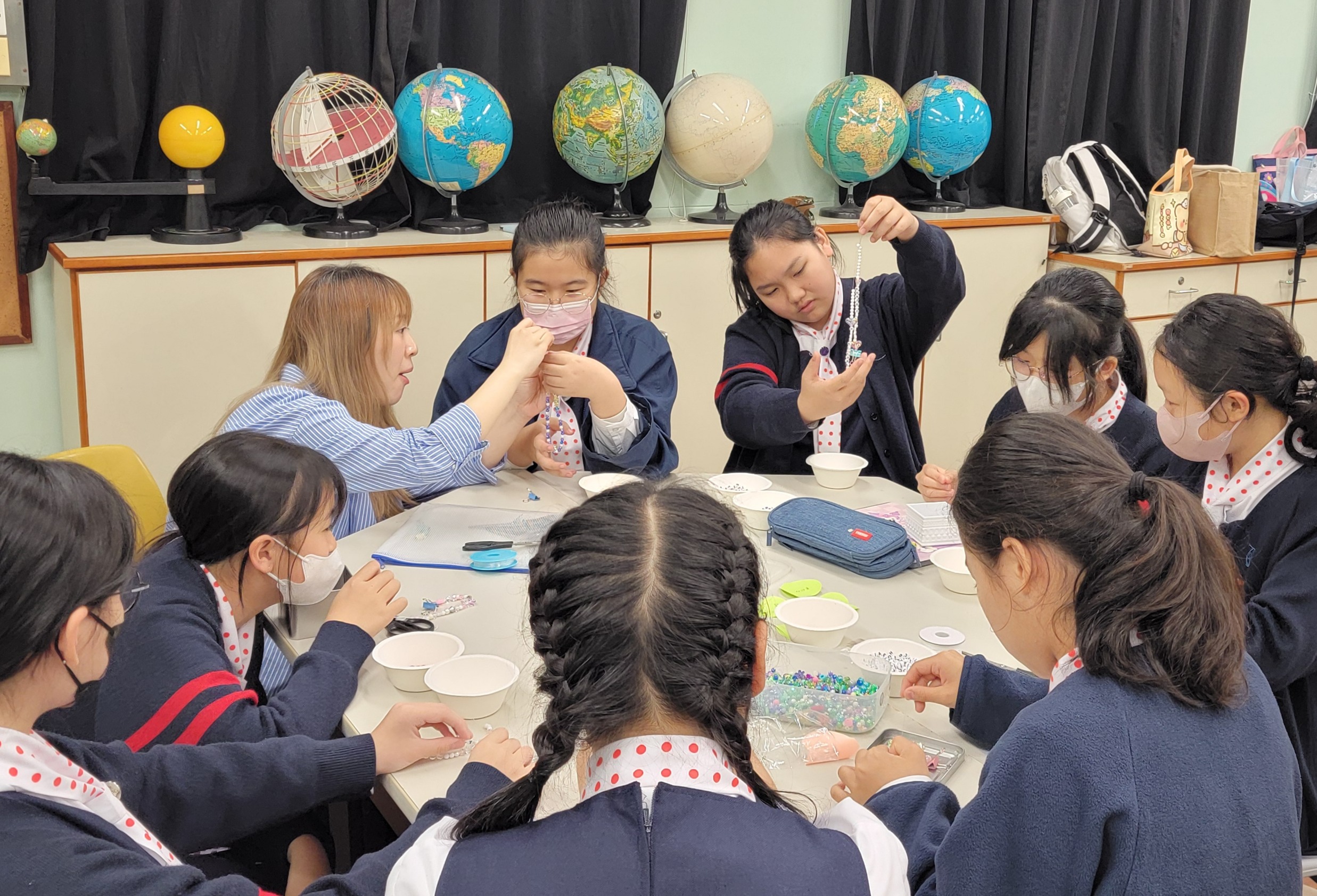 A person standing in front of a group of peopleDescription automatically generated