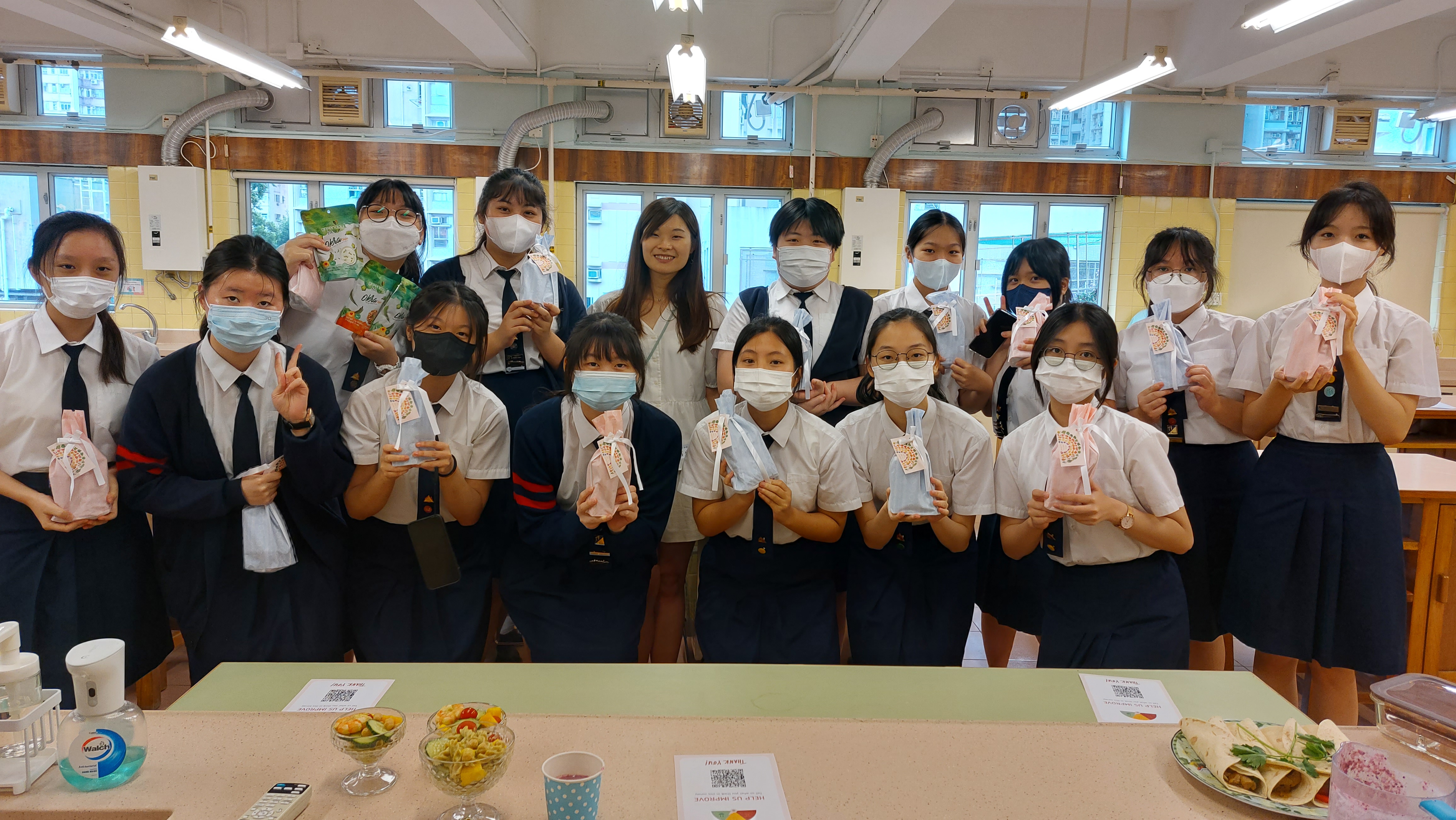 A group of people wearing masksDescription automatically generated